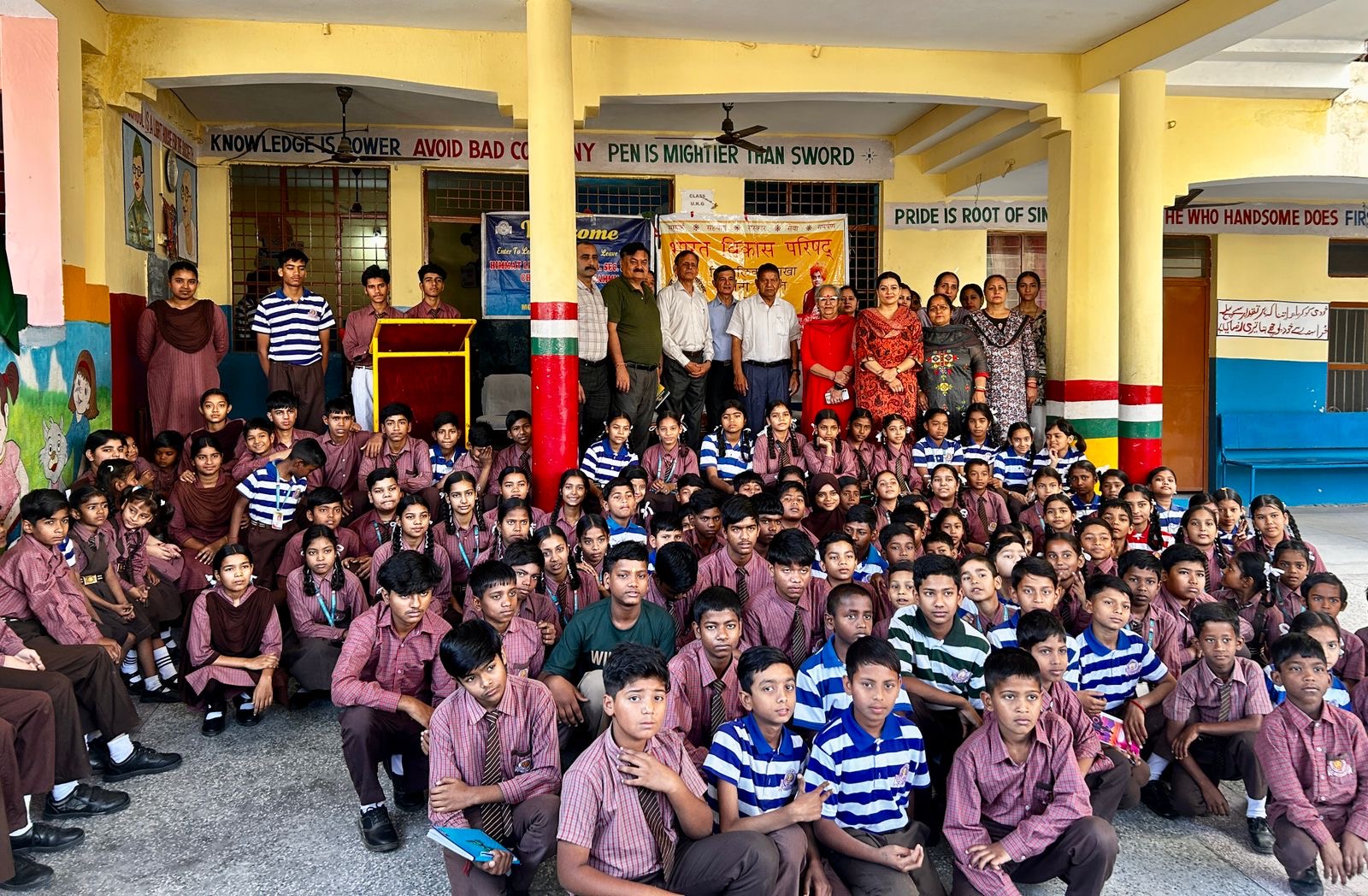 Students and teachers gathered on the school verandah